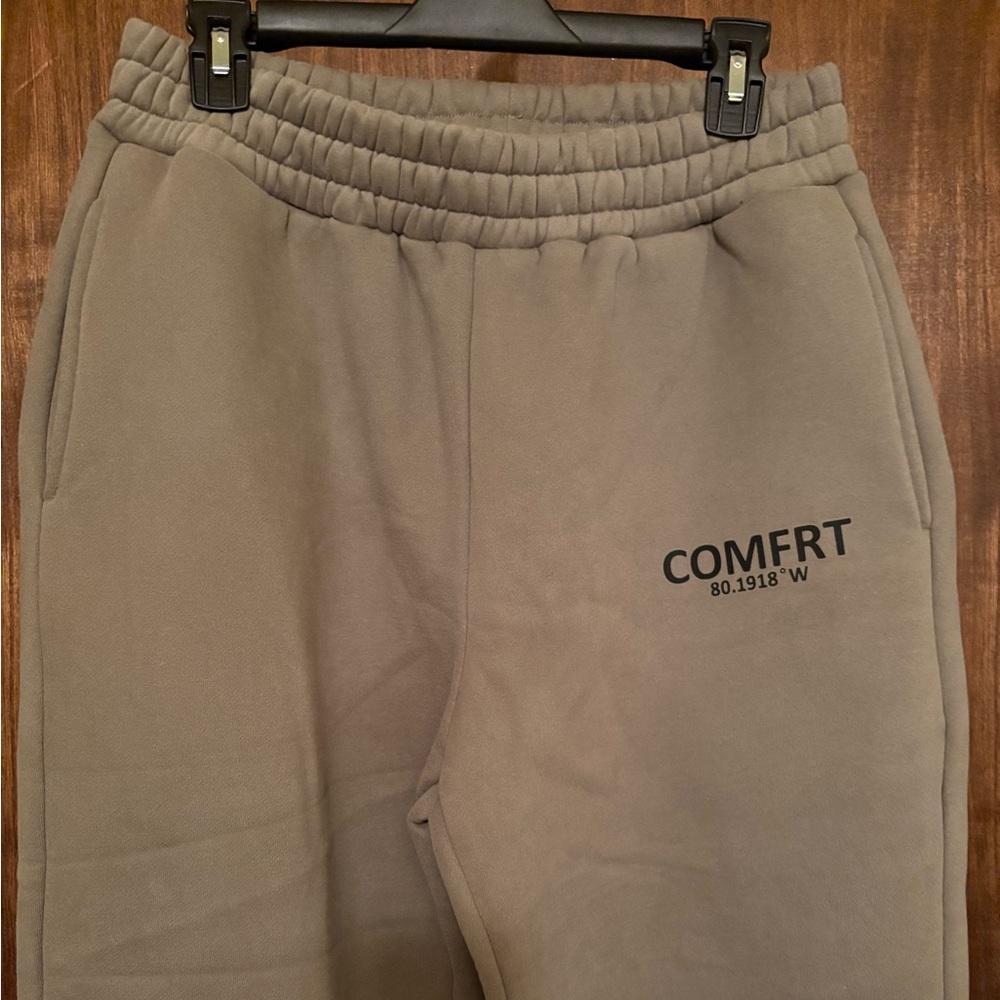 Sweat pants in the color military green.